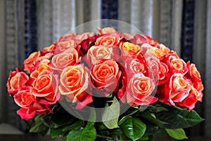 Large bouquet of many similar roses