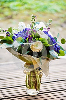 A large bouquet of white and blue spring flowers