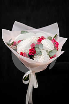 Large bouquet of white chrysanthemums and small red roses, isolated