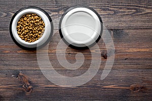 Large bowl of pet - cat food on wooden background top view mockup