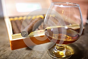 Large box of Cuban cigars on a wooden table