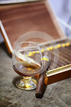 Large box of Cuban cigars on a wooden table