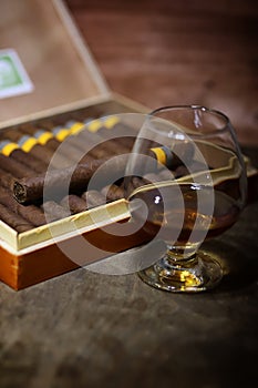 Large box of Cuban cigars on a wooden table