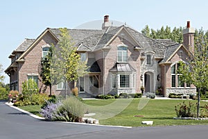 Large brick home with arched entry