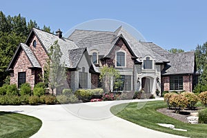 Large brick home with circular driveway