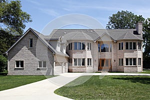 Large brick home with three car garage