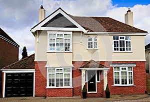 Large brick and rendered detached house photo