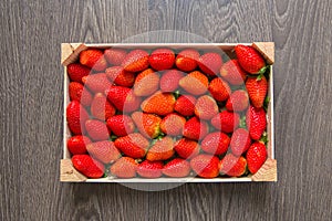 Large bright juicy red strawberries in a box. Top view