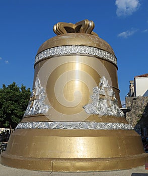 Large bronze bell with ornaments and crosses on the body