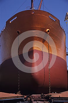 Large Bronze and red ship in Dry dock