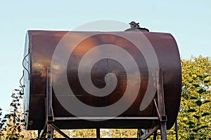 Large brown old tank against the sky