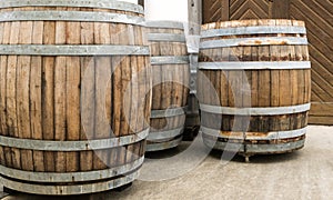 Large brown wooden barrels or wine vats