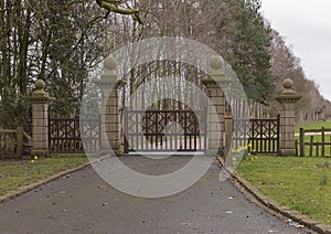 Large brown wooden gates which are closed