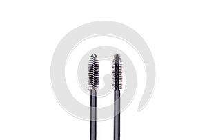 Large brush mascara Selikon and the usual fluffy difference between them on a white background