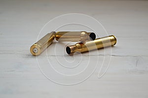 Large bullet macro photo on shabby light background