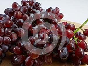 The large bunch of ripe red grapes