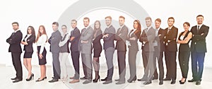 Large business team standing arms crossed in front