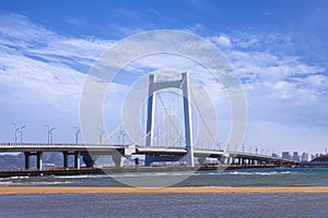 Large cable-stayed bridge against a blue sky, Yantai, China