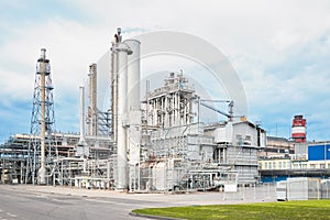 Large-capacity ammonia production workshop. Exterior of modern petrochemical plant with reactors and converters under heavy sky