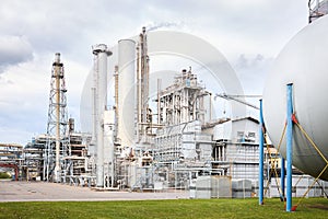 Large-capacity ammonia production workshop. Exterior of modern petrochemical plant with reactors spherical gasholder and