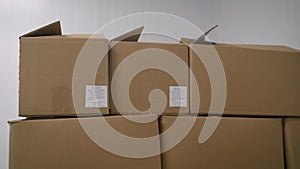 Large cardboard boxes in stock before shipping. A set of cardboard boxes in an industrial refrigerator. Cardboard boxes with