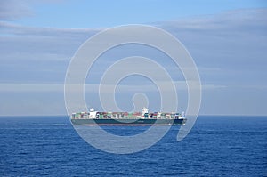 Large cargo container ship sailing near Japan.