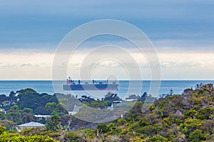 Large cargo vessel sailing in Port Phillip Bay waters. Mornington Peninsula, Melbourne, Australia.