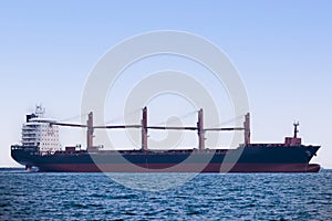 large carrier ship floating afternoon in sea, tugboat dragging container ship, blue sky evening background and sea front, mode of