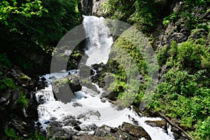 Large cascade of Lyazhgi Waterfall on a summer day
