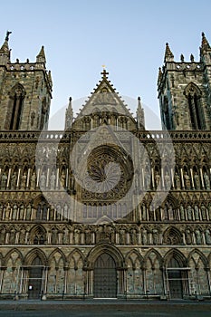 the large cathedral has a tall steeple next to it