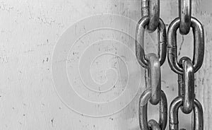 Large chain links on a gray background. The concept of bondage and restriction of freedom. Slavery. Free space for text