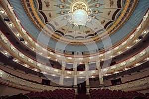 Large chandelier hangs on the theater hall