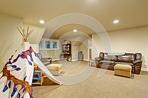 Large childrens play room with carpet.