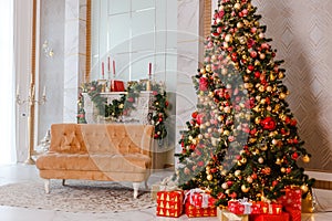 Large Christmas tree with red and gold balls and fireplace