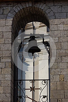 Large Church bell hanging outside. Close-up view of metal orthodox church bell