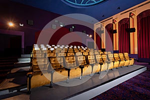 Large cinema theater with empty chair movie seats.