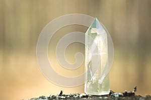 Large clear pure transparent great royal crystal of green quartz chalcedony diamond on nature blurred bokeh background close up