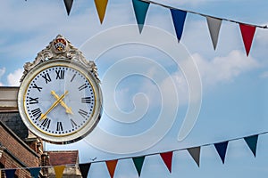 Large clock against blue sky