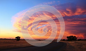 Large Cloud Formation Over Rural Road