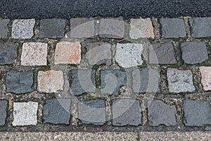 Large cobbles on the footpath