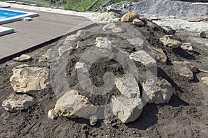 Large cobblestones on the Alpine hill, in the making