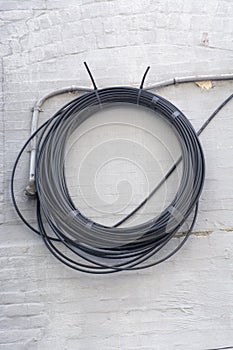 Cable coil on wall