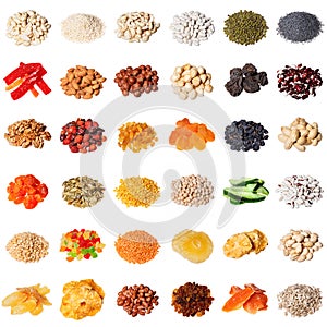 Large collection of different spices, herbs, nuts, dried fruits, beans, berries isolated on white background.