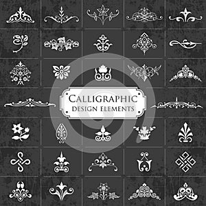 Large collection of ornate calligraphic design elements on a chalkboard background - vector set