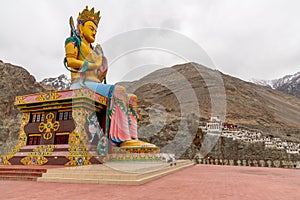 Large colorful Buddha statue at a monastery in India