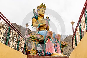 Large colorful Buddha statue at a monastery in India