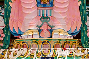 Large colorful Buddha statue at a monastery in India