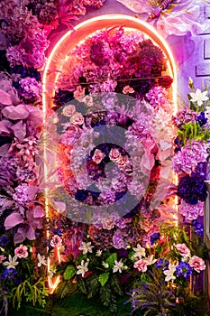 A large colorful flower arrangement reminiscent of a garden arch.