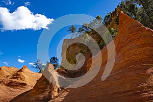 Large colorful ochre deposits, located in Roussillon, small Provensal town in  Natural Regional Park of Luberon, South of France