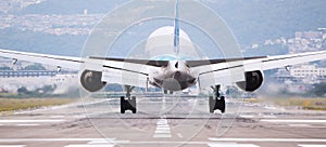 Large commercial airplane landing or take off on runway. Journey abroad tourism, oversea travel, flight transit photo